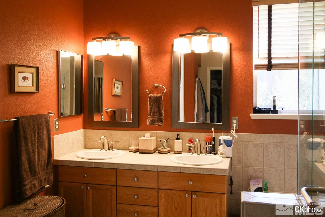 9760 Frankwood Drive Reno, NV 89521 - Photo 20 of 24 a bathroom with a double vanity sink and a mirror