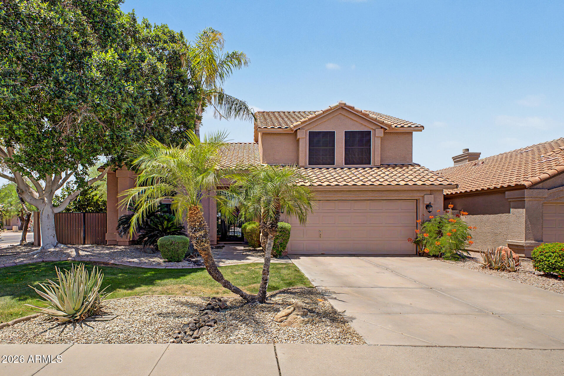 3948 North Ranier Mesa, AZ 85215 - Photo 4 of 69 a front view of a house with a yard and potted plants