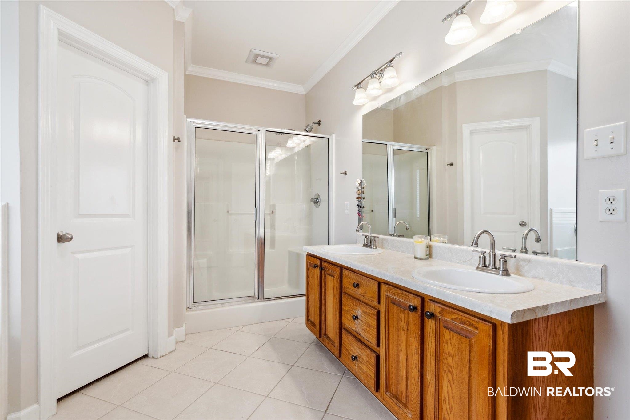1561 William Dunn Way Mobile, AL 36695 - Photo 12 of 28 Bathroom featuring tile patterned flooring, ornamental molding, and double sink vanity