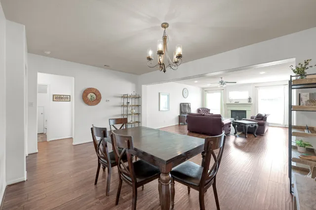a view of a house with a yard and porch