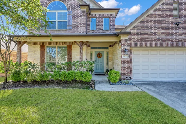 a living room with furniture a dining table and kitchen view