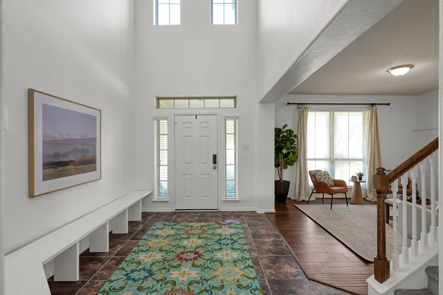 a large kitchen with a large counter top space and stainless steel appliances