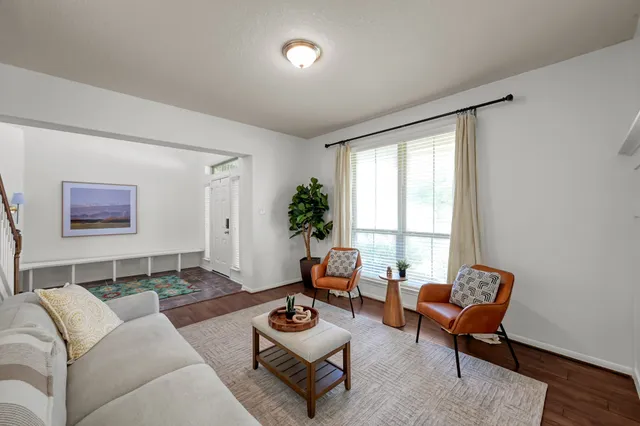 a bathroom with a sink a toilet a mirror and shower