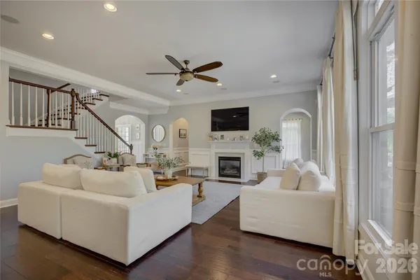a kitchen with stainless steel appliances a stove and white cabinets