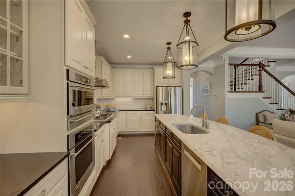 a kitchen with a sink and cabinets