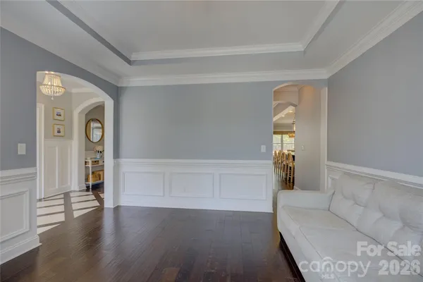 a living room with furniture fireplace and a flat screen tv