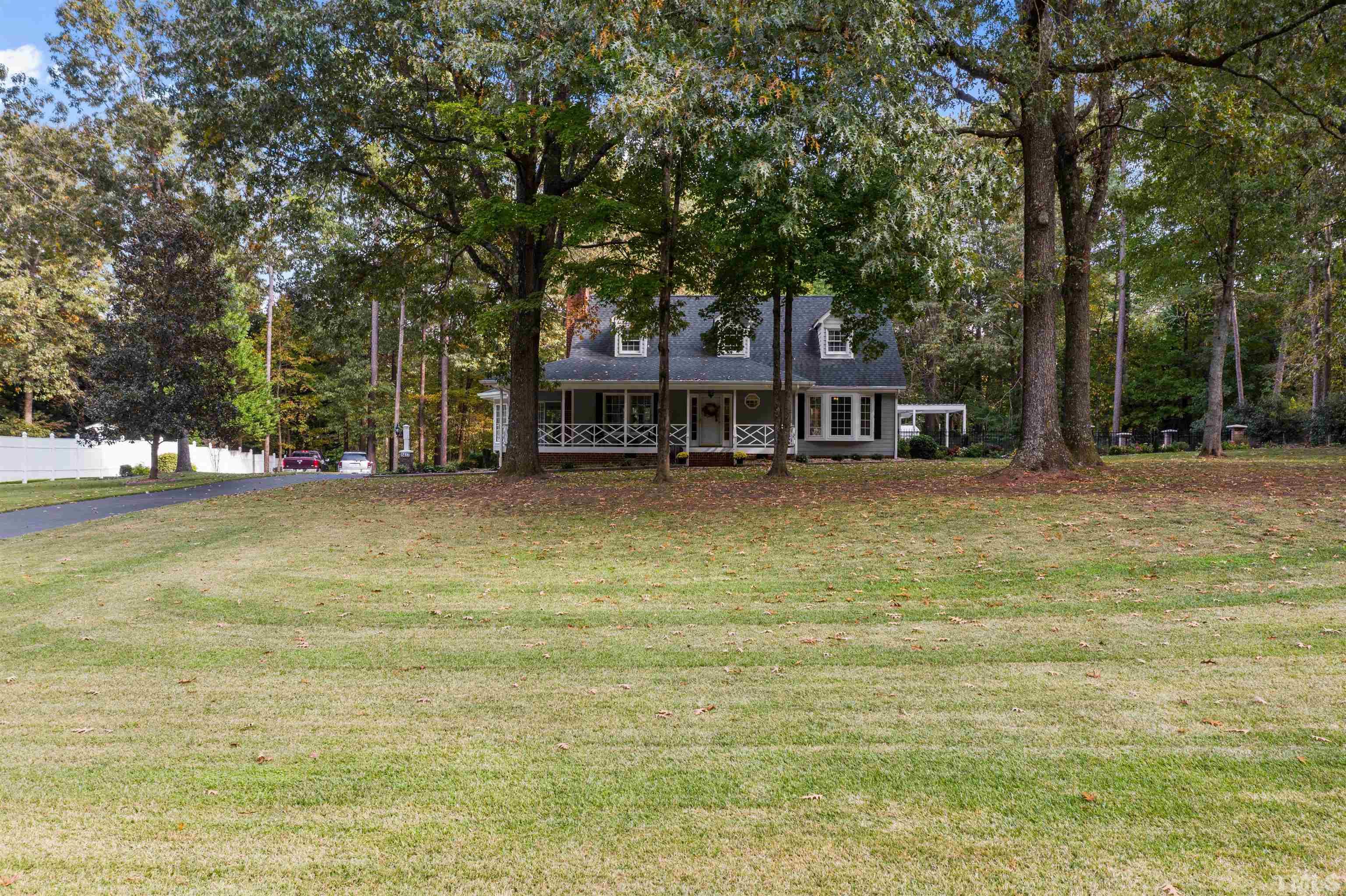 8417 Crowder Road Raleigh, NC 27603 - Photo 1 of 30 a view of a house with a swimming pool