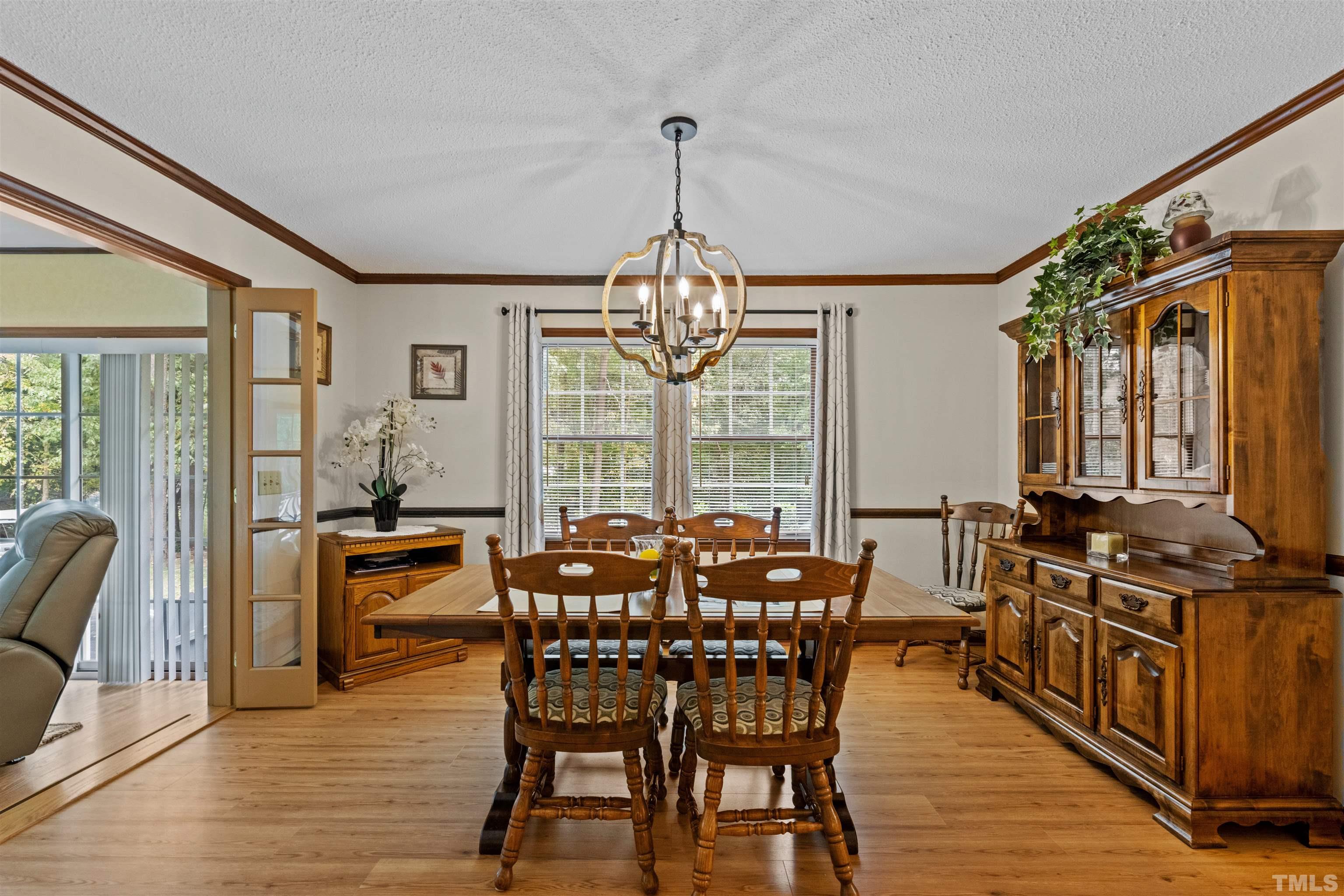8417 Crowder Road Raleigh, NC 27603 - Photo 11 of 30 a view of a dining room with furniture window and outside view