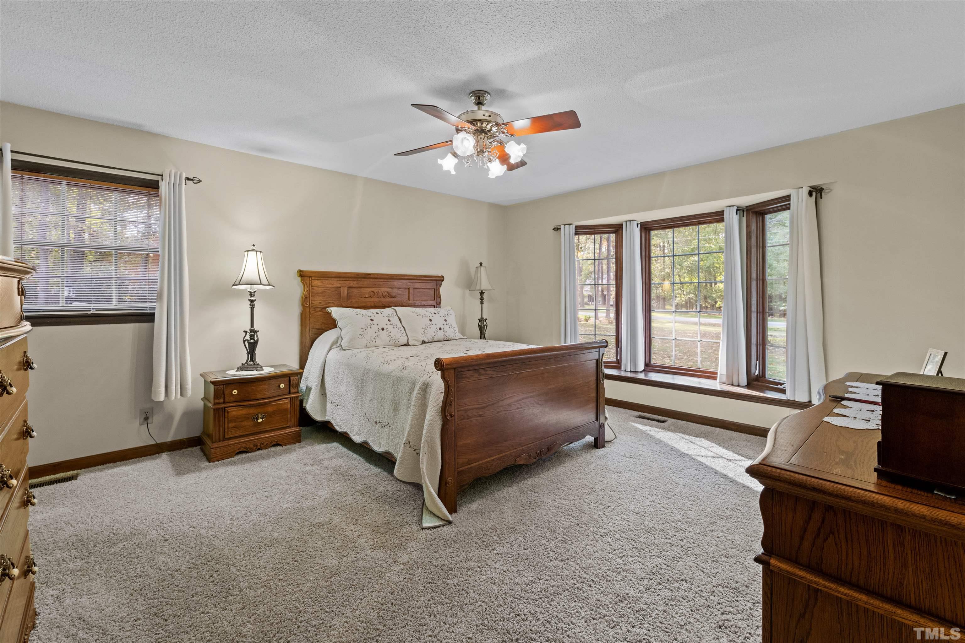 8417 Crowder Road Raleigh, NC 27603 - Photo 16 of 30 a bedroom with a bed and window