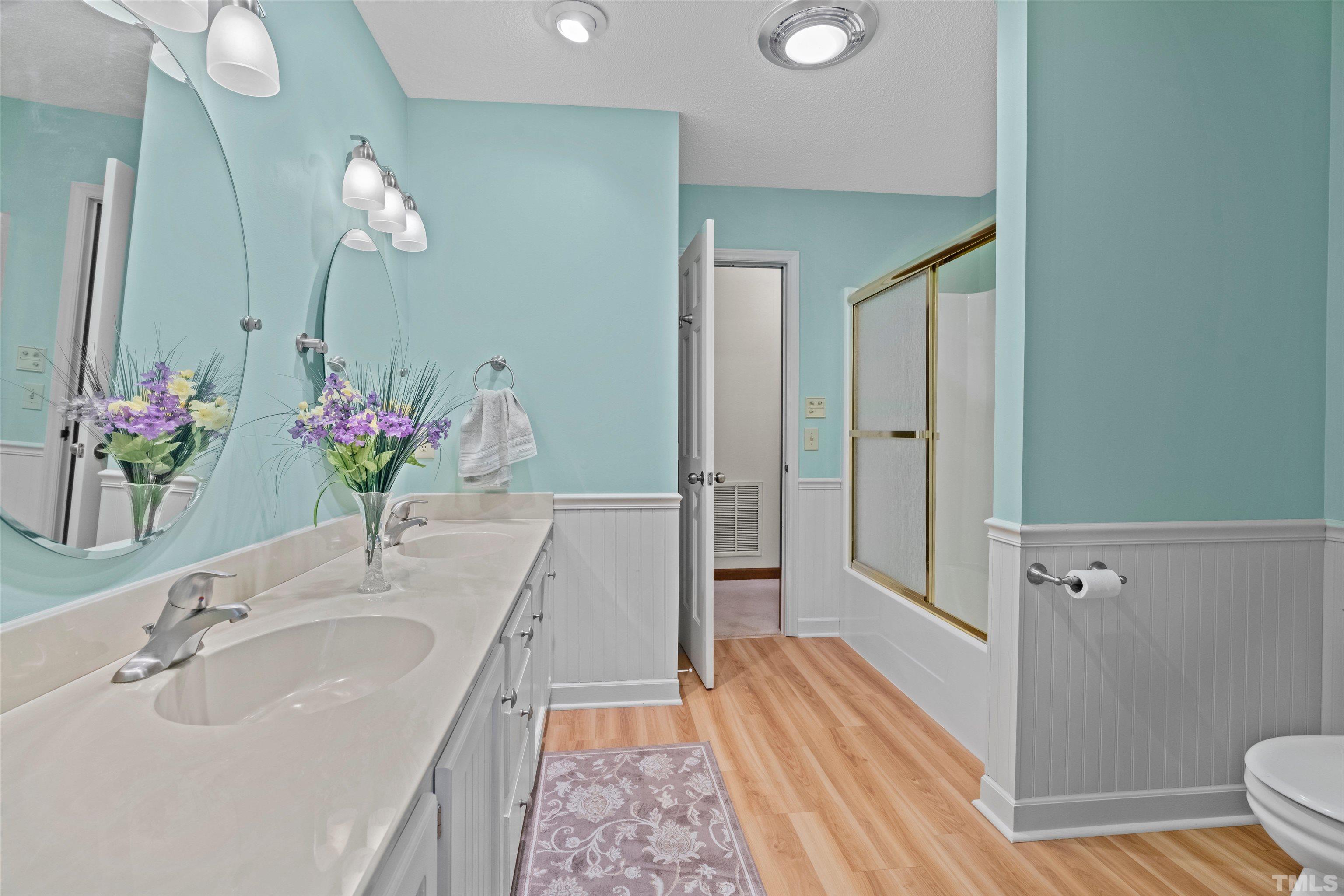 8417 Crowder Road Raleigh, NC 27603 - Photo 22 of 30 a bathroom with a sink and a mirror