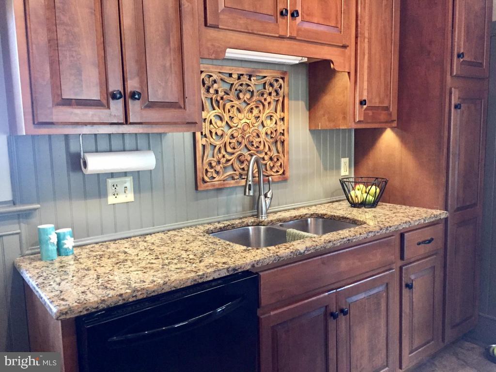737 Penn Avenue Lititz, PA 17543 - Photo 12 of 35 a kitchen with granite countertop a sink dishwasher and cabinets