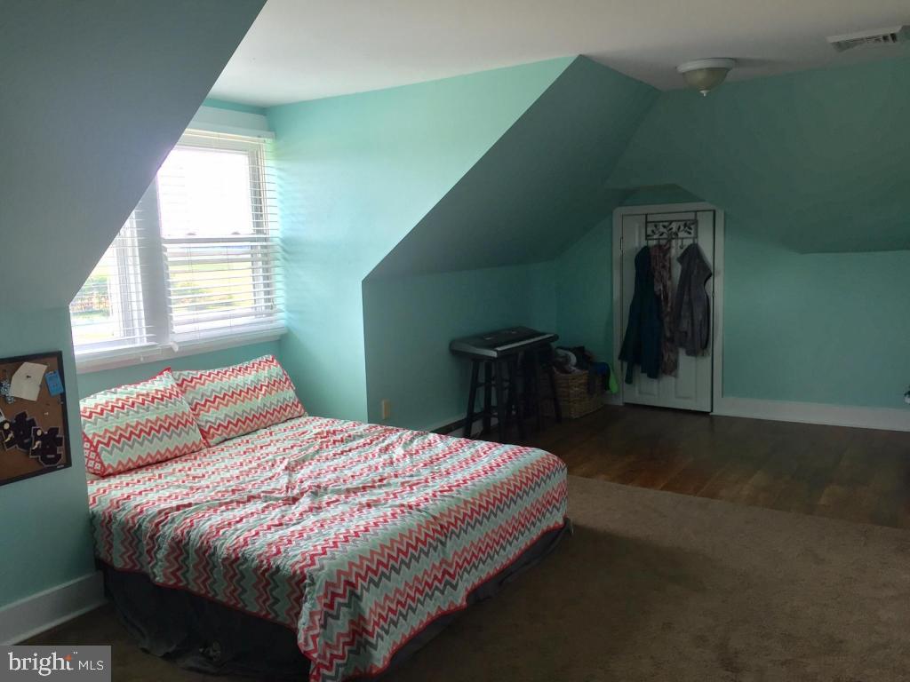 737 Penn Avenue Lititz, PA 17543 - Photo 22 of 35 a bed sitting in a bedroom next to a window