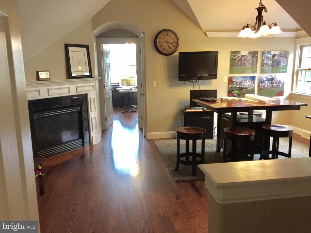 737 Penn Avenue Lititz, PA 17543 - Photo 31 of 35 a living room with furniture a fireplace and a flat screen tv