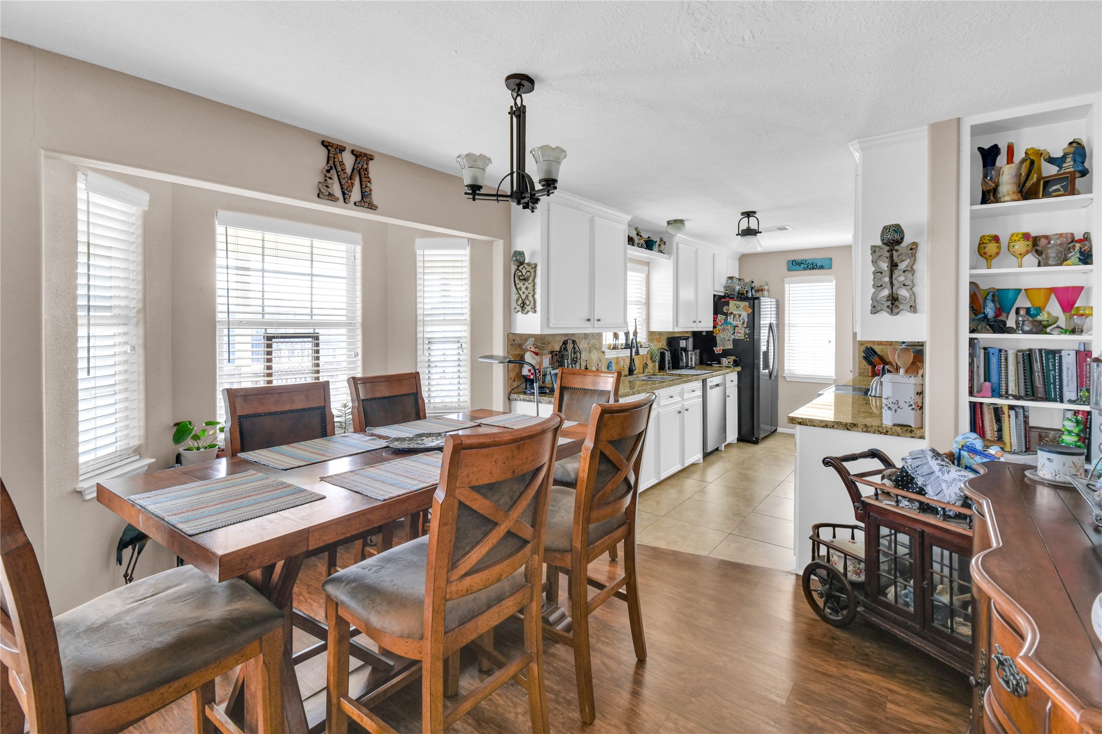 115 Driftwood Road Freeport, TX 77541 - Photo 11 of 21 a view of a dining room with furniture window and wooden floor