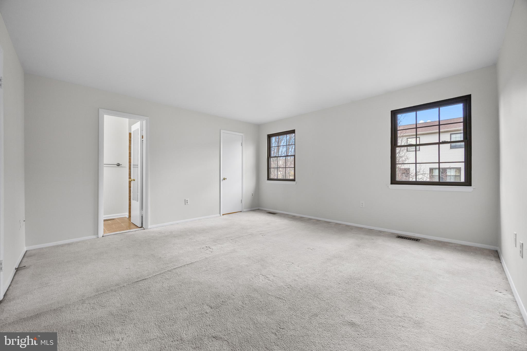 33 Badger Gate Court Baltimore, MD 21228 - Photo 23 of 39 an empty room with windows and closet