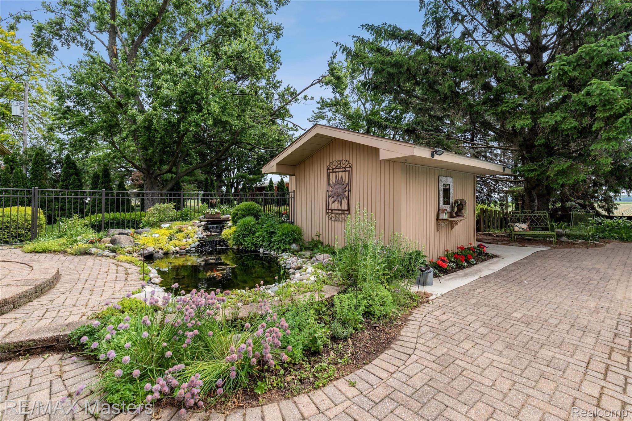 2273 Strasburg Road Monroe, MI 48161 - Photo 39 of 59 Art Studio/Cabana & Pond Surrounded By Paver Paths