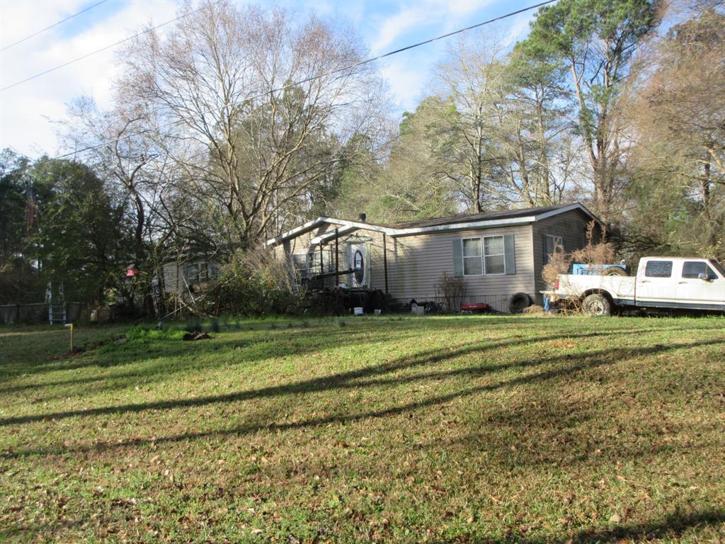 109 Amy Lane Minden, LA 71055 - Photo 3 of 8 a front view of a house with a yard and trees