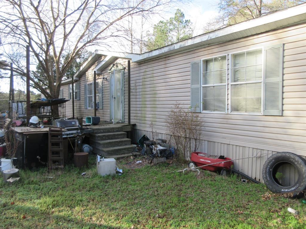 109 Amy Lane Minden, LA 71055 - Photo 6 of 8 a backyard of a house with barbeque oven table and chairs