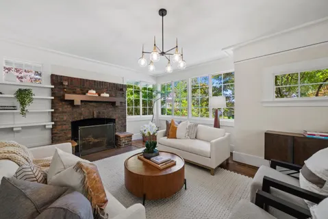 a view of a dining room with furniture wooden floor and chandelier
