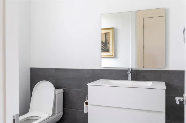 a bathroom with a toilet and a sink