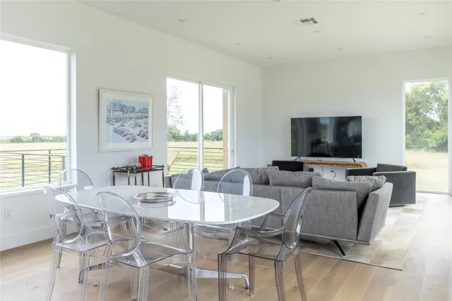 a view of a dining room with furniture window and outside view