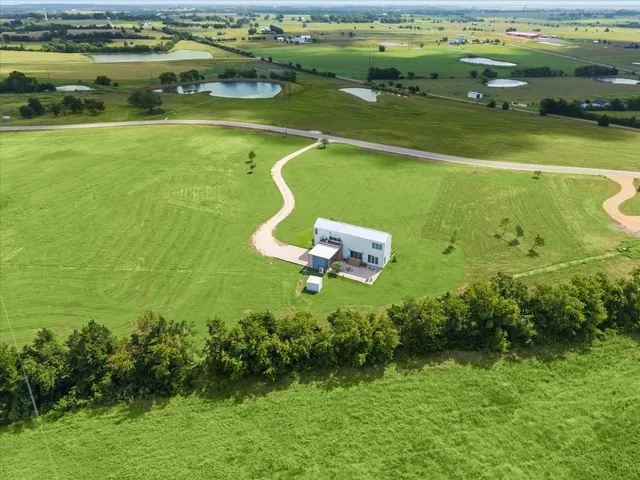 a view of a swimming pool with a yard