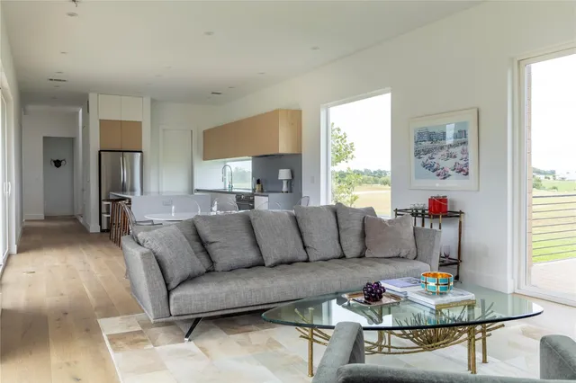 a living room with furniture and a table
