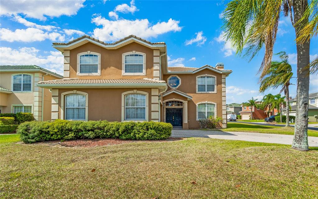 a front view of a house with a yard