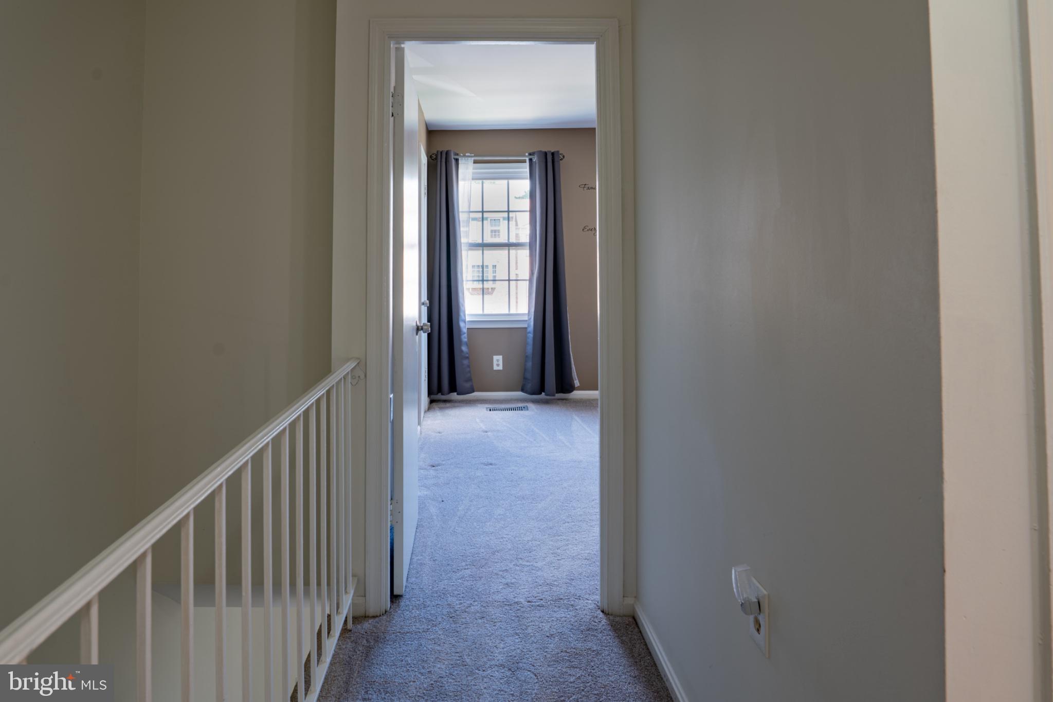 2913 Seminole Road Woodbridge, VA 22192 - Photo 15 of 34 a view of a hallway with wooden floor