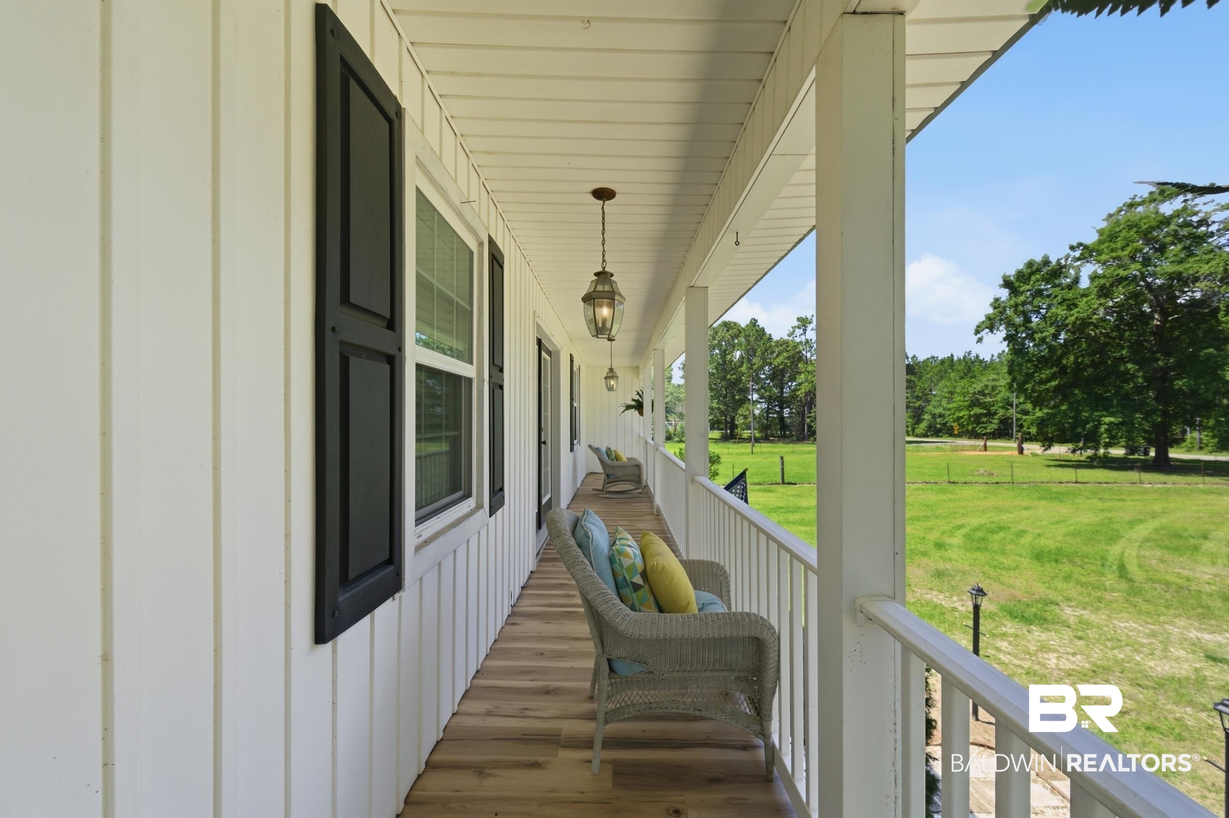 51620 Robert White Road Bay Minette, AL 36507 - Photo 56 of 81 Expansive covered porch with wood-finish flooring