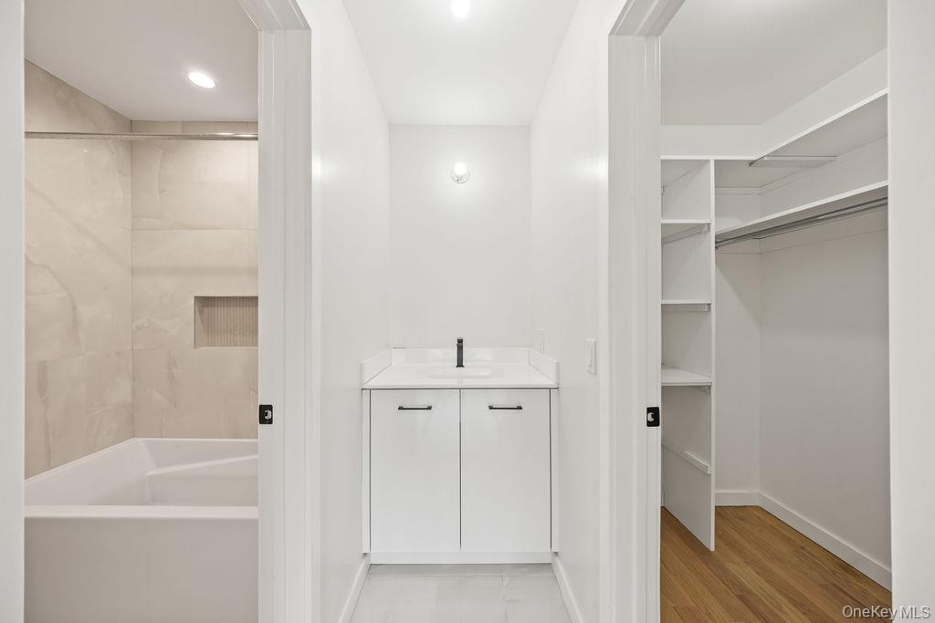 62 Blauvelt Road, Unit 202 Monsey, NY 10952 - Photo 22 of 34 a bathroom with a bathtub and a shower