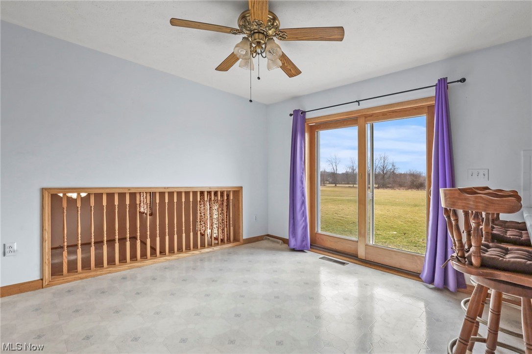 411 Adario West Road Shiloh, OH 44878 - Photo 11 of 35 Empty room with ceiling fan