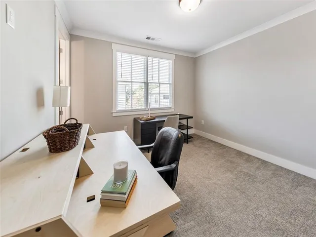 a bathroom with a toilet a sink a mirror and a shower