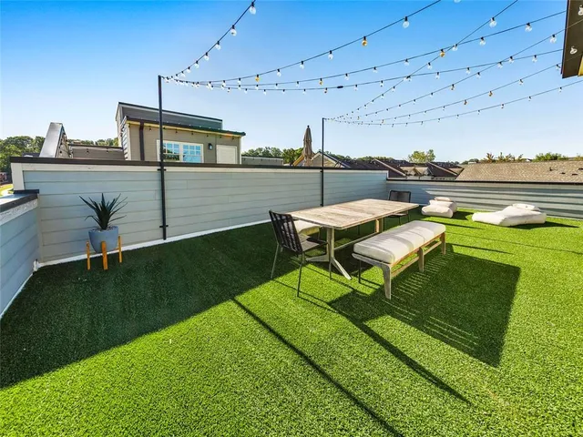a view of a porch with wooden floor and ceiling fan