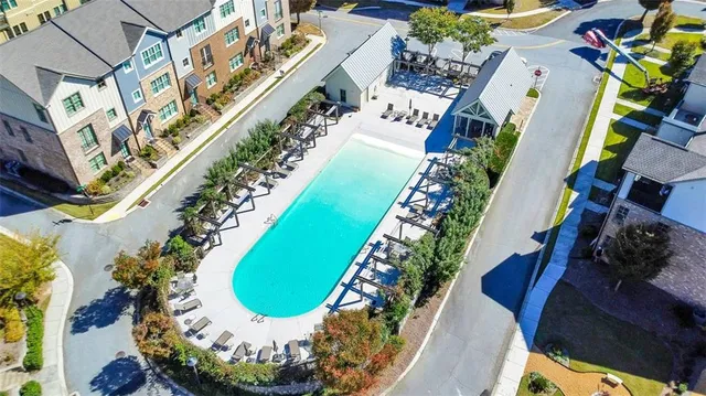 a view of a chairs and table in a backyard