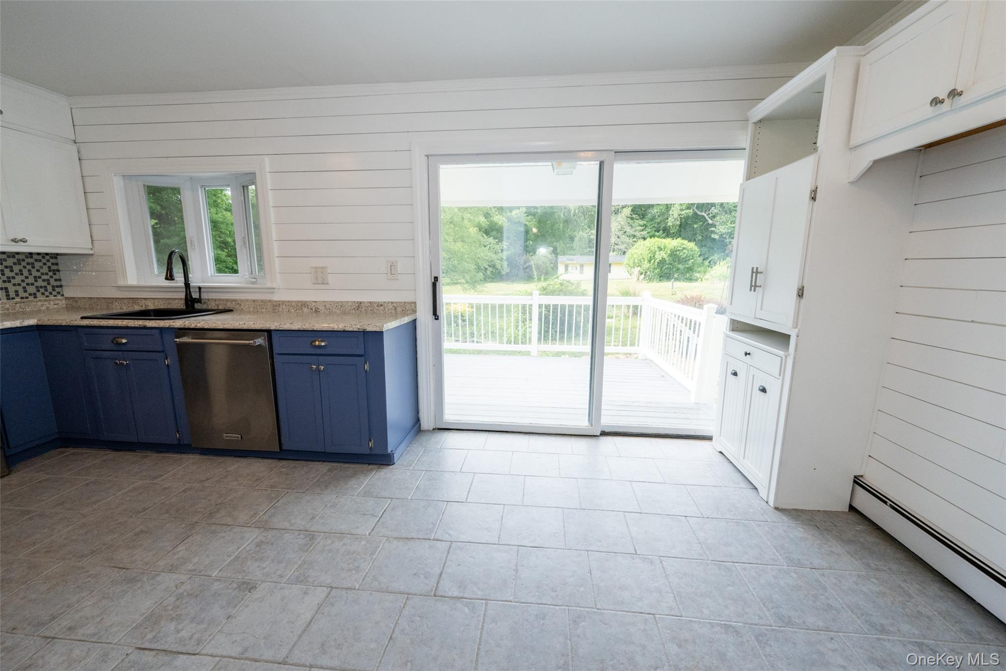 136 Foggintown Road Brewster, NY 10509 - Photo 7 of 50 a large kitchen with granite countertop a cabinets and white stainless steel appliances