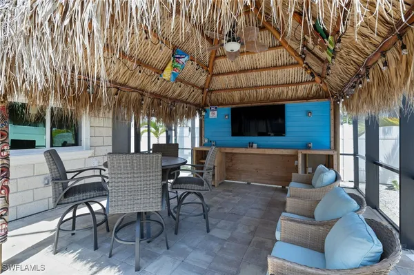 a outdoor living space with patio furniture and a fireplace