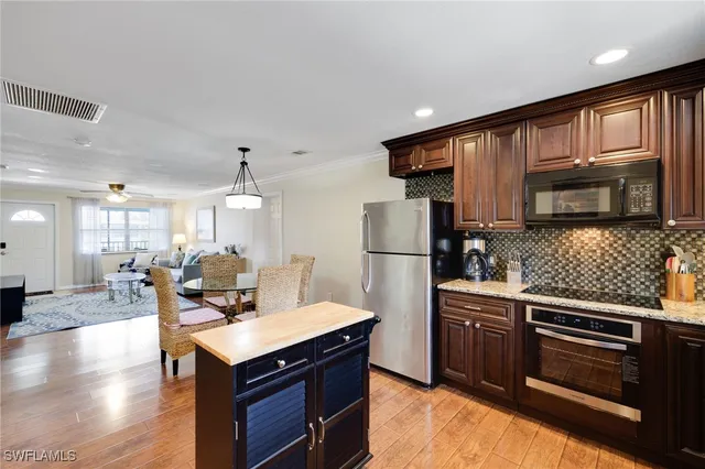 a kitchen with a sink and a refrigerator