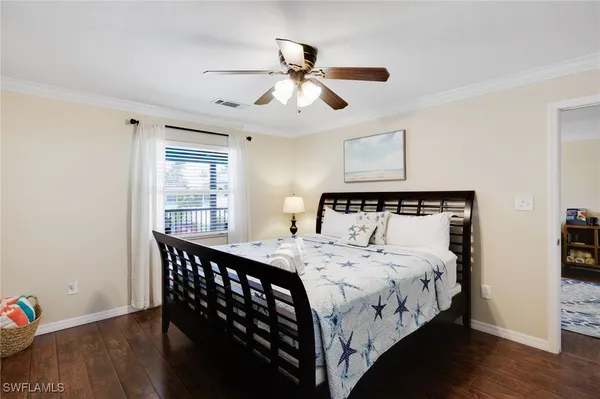 a bathroom with a double vanity sink toilet mirror and shower