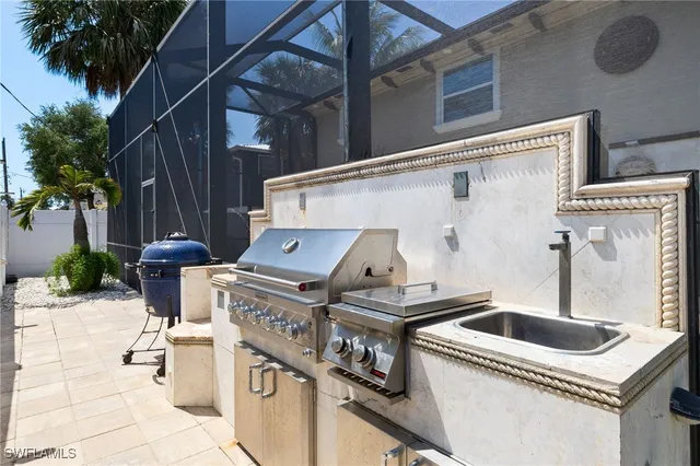 a kitchen that has a stove and a sink