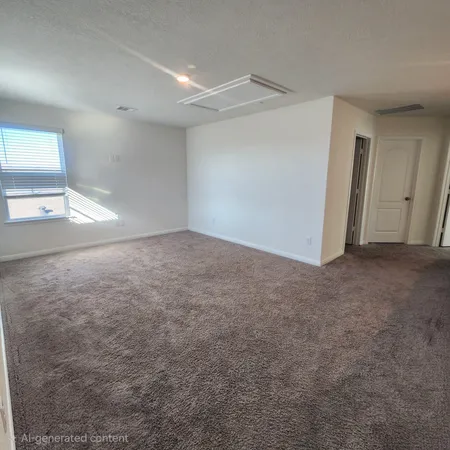 an empty room with a empty space and windows