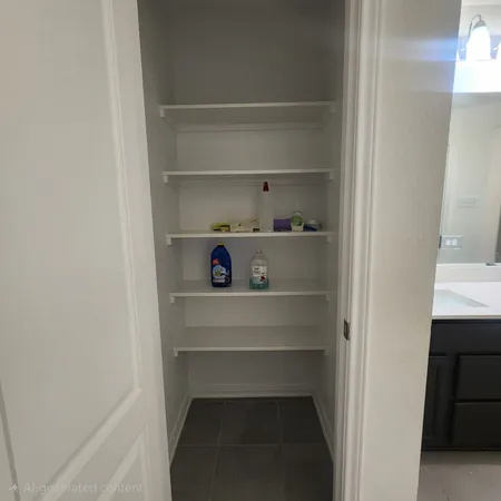 a view of an empty walk in closet