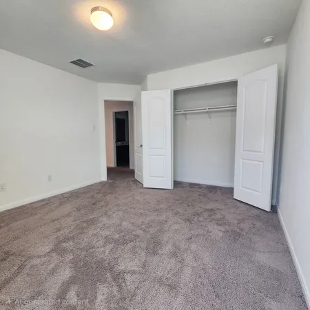 an empty room with closet and bathroom