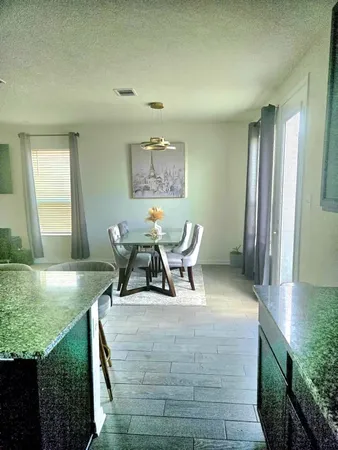 a living room with furniture and a yard