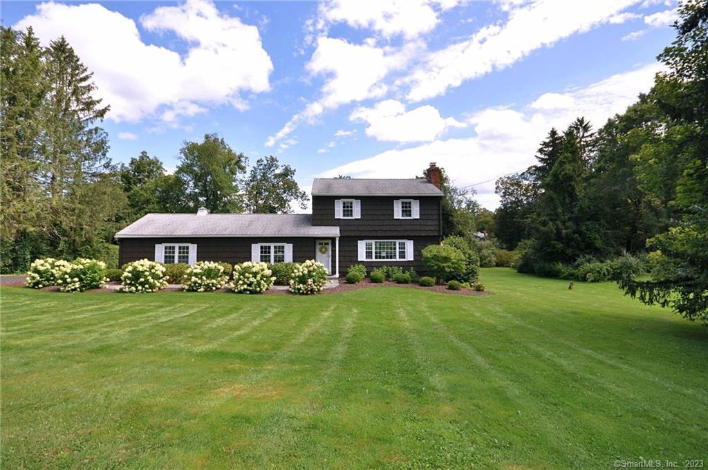 16 Lincoln Road Newtown, CT 06470 - Photo 1 of 1 a view of a house with a big yard and large trees