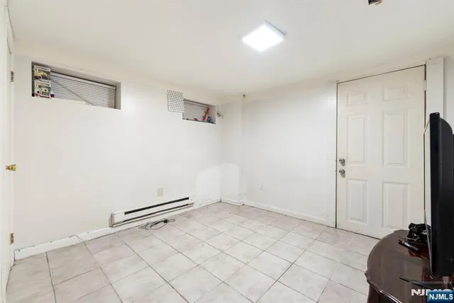 a room with a sink and a mirror