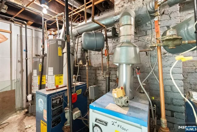 a view of walk in closet with clothes