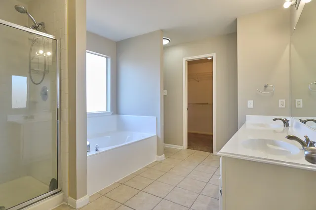 a bathroom with a bathtub and a sink