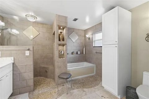a bathroom with a shower and a toilet