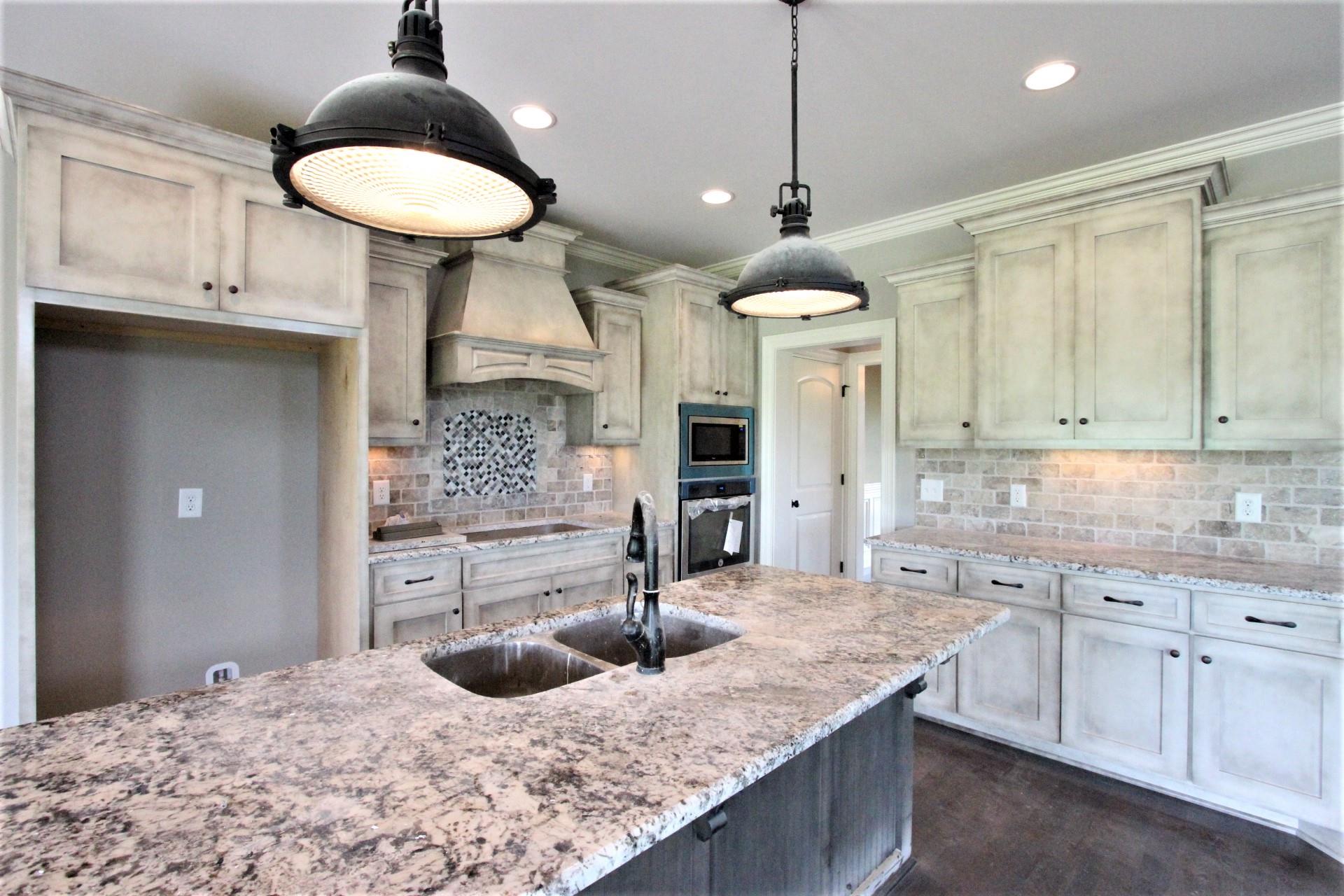 807 Philadelphia Road, Unit 3 Lebanon, TN 37087 - Photo 11 of 23 a kitchen with stainless steel appliances granite countertop a sink a stove and cabinets